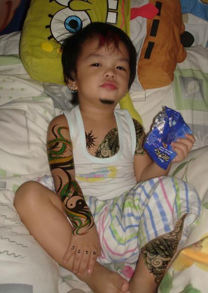 I am all for some tattoos, but really? Forcing your 7 year old to not only 